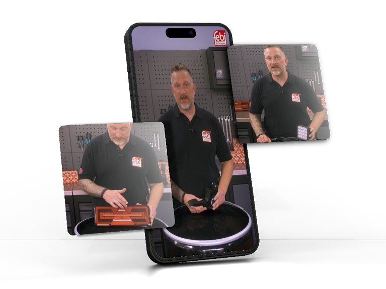 An experienced technician holding a Cabin Electrics and Lighting component in a workshop