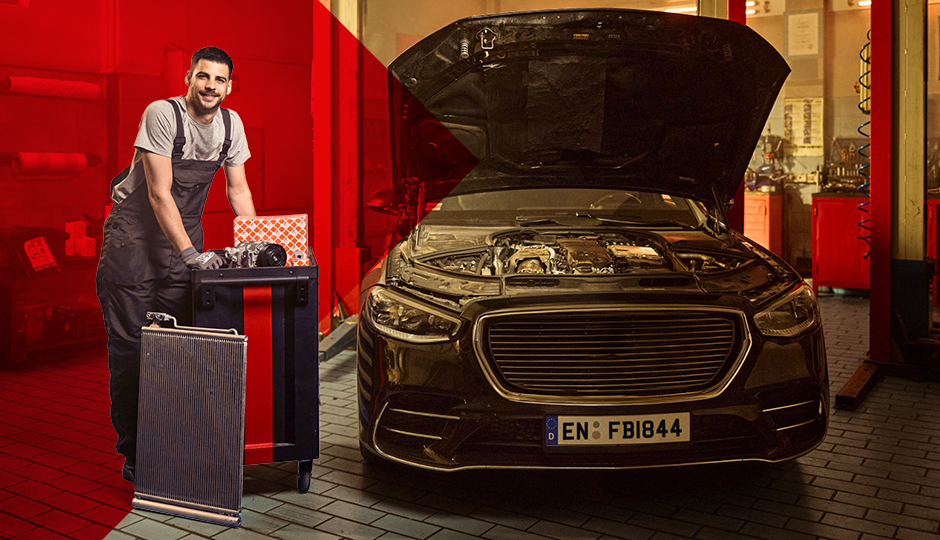 Mechanic in workshop with Air Conditioning products